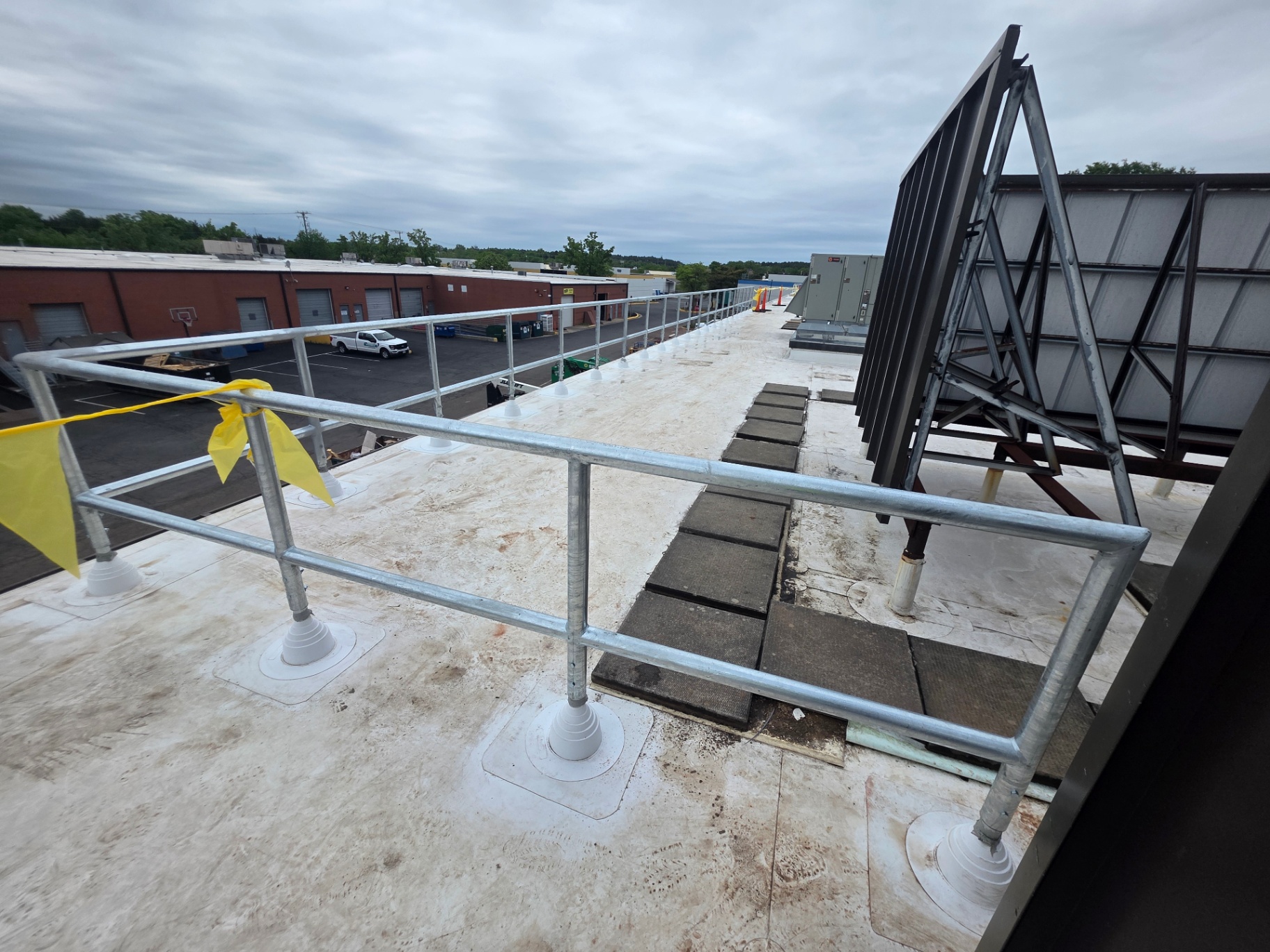 Galvanized safety railing on commercial rooftop